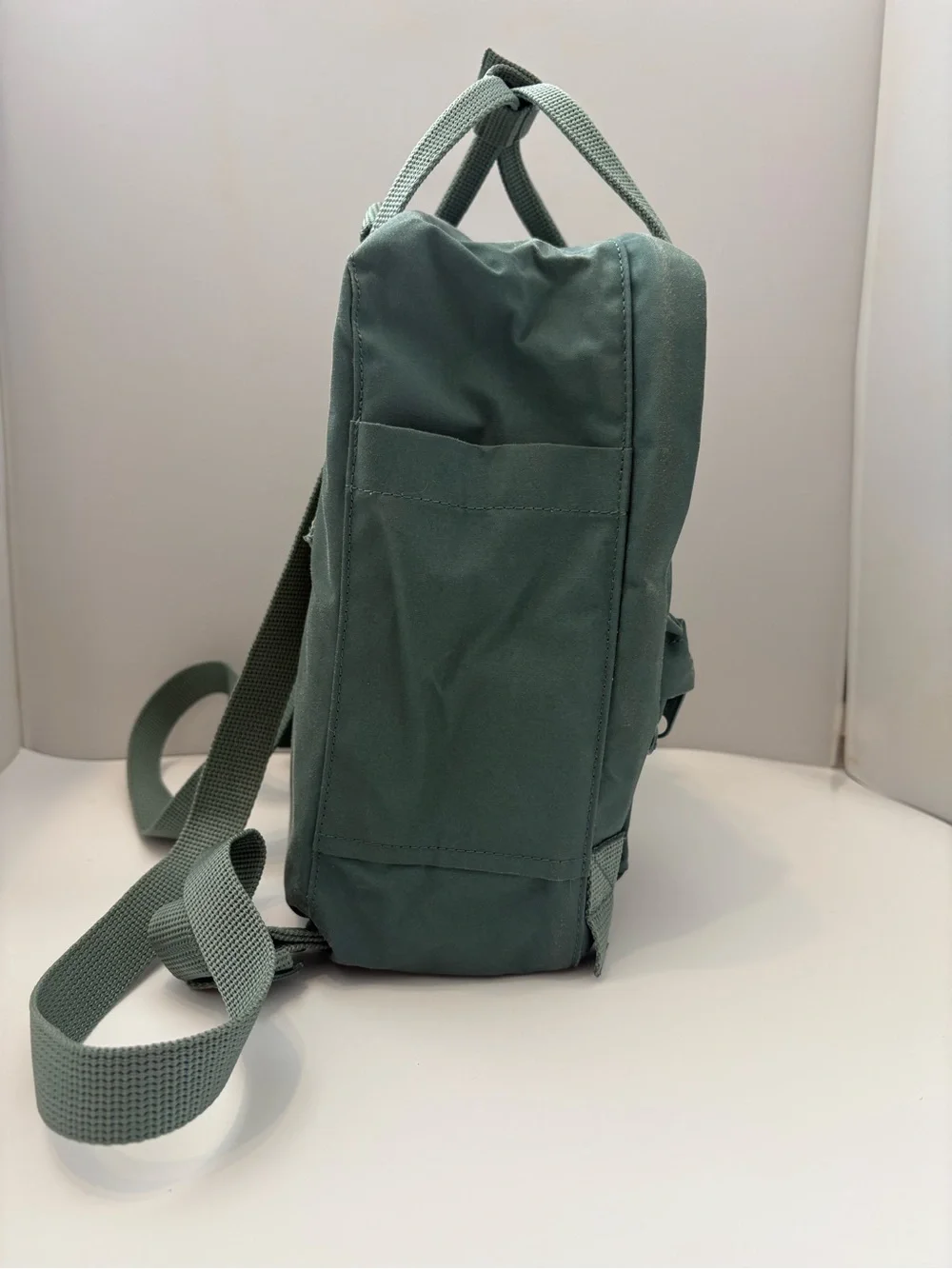 Fjallraven Kanken Mini Backpack in Sage Green with Red Logo